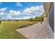 Spacious paved patio with a view of the lake at 4010 Navigator Way, Kissimmee, FL 34746
