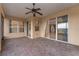 Screened patio with tile flooring and views of the backyard at 4010 Navigator Way, Kissimmee, FL 34746