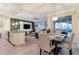 Open concept dining room with seating for six, adjacent to kitchen and living room at 4349 Quote St, Kissimmee, FL 34746