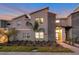Modern two-story home with stone accents and landscaping at 4349 Quote St, Kissimmee, FL 34746