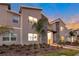 Modern two-story townhome with lighted entryway and landscaped grounds at 4349 Quote St, Kissimmee, FL 34746