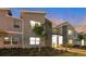 Modern two-story townhome with lighted entryway and landscaped grounds at 4349 Quote St, Kissimmee, FL 34746