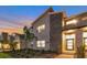 Modern two-story townhome with lighted entryway and landscaped grounds at 4349 Quote St, Kissimmee, FL 34746