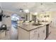 Large kitchen island with seating and a double sink, perfect for entertaining at 4349 Quote St, Kissimmee, FL 34746