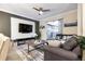 Comfortable living room with sectional sofa, large TV, and access to patio at 4349 Quote St, Kissimmee, FL 34746