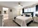 Spacious main bedroom with plush carpeting, large bed, and ensuite bathroom at 4349 Quote St, Kissimmee, FL 34746