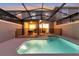 Private screened pool with safety fence and patio access at 4349 Quote St, Kissimmee, FL 34746