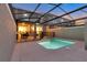 Private screened pool with safety fence and patio access at 4349 Quote St, Kissimmee, FL 34746