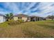 House exterior and backyard with landscaping and lawn at 4483 Casablanca Ave, Kissimmee, FL 34746