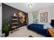 Bedroom with a bed and dark accent wall at 4483 Casablanca Ave, Kissimmee, FL 34746