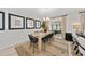 Dining room with wooden table, black chairs, and access to a patio at 4483 Casablanca Ave, Kissimmee, FL 34746
