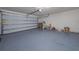 Garage with automatic door and painted floor at 4483 Casablanca Ave, Kissimmee, FL 34746