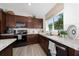 Modern kitchen with stainless steel appliances and light wood cabinets at 4483 Casablanca Ave, Kissimmee, FL 34746