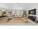 Open living room with comfortable seating, large TV, and natural light at 4483 Casablanca Ave, Kissimmee, FL 34746