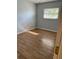 Simple bedroom with wood-look flooring at 4607 Pine Lake Dr, St Cloud, FL 34769