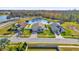 Community view showcasing a pond, homes, and a playground at 4702 Ashurst St, Kissimmee, FL 34758