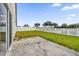 Fenced backyard with patio and pond view at 4702 Ashurst St, Kissimmee, FL 34758