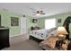 Bedroom with ceiling fan and light green walls at 4702 Ashurst St, Kissimmee, FL 34758