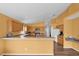 Kitchen with breakfast bar and wood cabinets at 4702 Ashurst St, Kissimmee, FL 34758