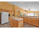Kitchen with island and wood cabinets at 4702 Ashurst St, Kissimmee, FL 34758