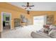 Living room with vaulted ceiling and sliding doors to backyard at 4702 Ashurst St, Kissimmee, FL 34758