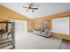 Living room with vaulted ceiling and view of backyard at 4702 Ashurst St, Kissimmee, FL 34758
