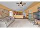 Living room with vaulted ceiling and view of kitchen at 4702 Ashurst St, Kissimmee, FL 34758
