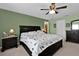 Spacious bedroom with ceiling fan and dark wood furniture at 4702 Ashurst St, Kissimmee, FL 34758