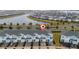 Townhome community with lake and surrounding houses at 4806 Tribute Trl, Kissimmee, FL 34746