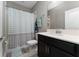 Bathroom with shower/tub combo and dark vanity at 4806 Tribute Trl, Kissimmee, FL 34746
