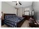 Primary bedroom with king-size bed and dresser at 4806 Tribute Trl, Kissimmee, FL 34746