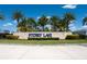 Storey Lake community entrance with stone signage and palm trees at 4806 Tribute Trl, Kissimmee, FL 34746