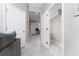 Hallway with powder room and access to other rooms at 4806 Tribute Trl, Kissimmee, FL 34746