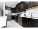 Modern kitchen with stainless steel appliances and an island at 4806 Tribute Trl, Kissimmee, FL 34746