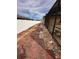 Backyard with red pavers, gravel, and white fence at 4878 Zion Dr, St Cloud, FL 34772