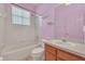 Small bathroom with shower/tub combo and pink walls at 4878 Zion Dr, St Cloud, FL 34772