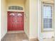 Double red doors with a tiled entryway at 4878 Zion Dr, St Cloud, FL 34772