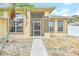 Front entry with double doors and screened porch at 4878 Zion Dr, St Cloud, FL 34772