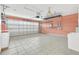 Garage with tiled floor and ample storage shelving at 4878 Zion Dr, St Cloud, FL 34772