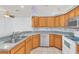 Spacious kitchen with wood cabinets and granite countertops at 4878 Zion Dr, St Cloud, FL 34772