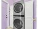 Laundry room with LG stacked washer and dryer at 4878 Zion Dr, St Cloud, FL 34772