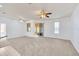 Open living room with wood-paneled sunroom at 4878 Zion Dr, St Cloud, FL 34772