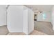 Spacious living room with carpeted floors and a view of the kitchen at 4878 Zion Dr, St Cloud, FL 34772
