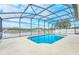 Enclosed pool with screened patio and lake view at 4878 Zion Dr, St Cloud, FL 34772