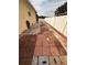 Side yard with brick and stone pathway, showing house exterior at 4878 Zion Dr, St Cloud, FL 34772