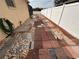 Side yard with brick and stone pathway next to house exterior at 4878 Zion Dr, St Cloud, FL 34772
