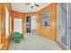 Sunroom with wood paneling, tile floor and sliding doors at 4878 Zion Dr, St Cloud, FL 34772