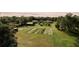 Aerial view of a property with multiple buildings and large garden at 4999 Disston Dr, St Cloud, FL 34771