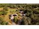 Aerial view showing home, barn, garden, and expansive property at 4999 Disston Dr, St Cloud, FL 34771