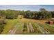 Aerial view showing a large garden and surrounding trees at 4999 Disston Dr, St Cloud, FL 34771